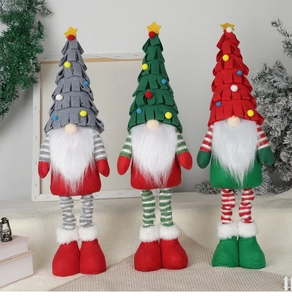 Close-up of three festive Christmas tree gnomes with striped legs and colorful pom-poms