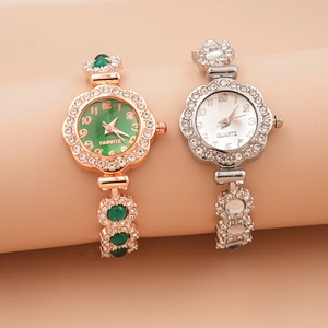 Close-up of rhinestone encrusted round quartz watches in rose gold and silver finishes