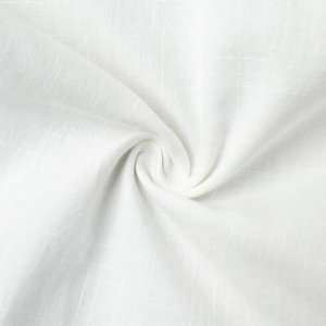 Macro detail of breathable white cotton fabric showing smooth plain weave and soft texture