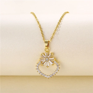 Detailed view of 18k gold flower pendant with zircons and crescent ring design