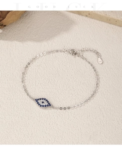 Detailed macro view of S925 sterling silver evil eye bracelet with blue and white zircons