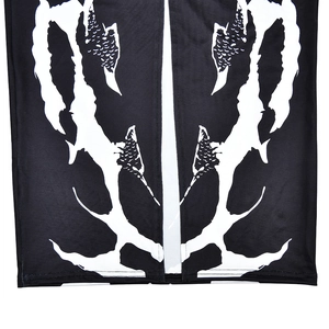 Detail shot of black fabric hem featuring white abstract skeletal print and split seam