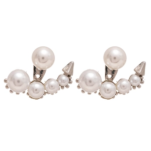 Asymmetric silver needle stud earrings featuring white pearls and punk style metal spikes