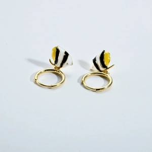 Macro detail of S925 sterling silver tropical fish earrings with colorful enamel finish