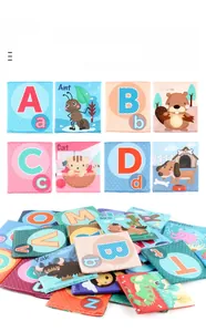 Macro view of double-sided soft alphabet cards with animal patterns and stitching