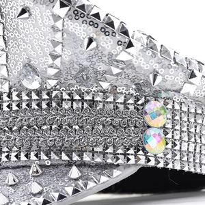 Silver punk military hat with sparkling sequins, metallic rivets and iridescent rhinestones
