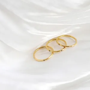 Three-piece stackable ring set in 18K gold plated titanium steel with micro cubic zirconia