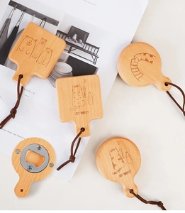 Detail of wooden magnetic bottle openers with cute animal laser engravings and leather strap