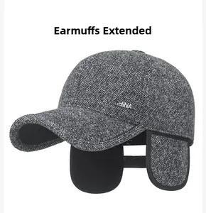 Detail view of grey herringbone pattern baseball cap with metal CHINA logo and earflaps