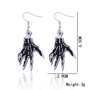 Detail shot of purple zombie hand earrings with 6.5cm length and 3g weight dimensions