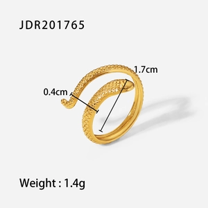 Detailed macro view showing the snake-shaped gold ring dimensions and engraved scale textures