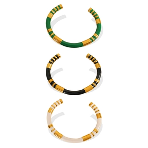 Minimalist stainless steel enamel bangles in green black and beige with gold metal accents