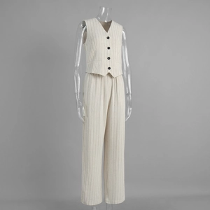 Detail of pinstripe vest and trousers set in cream white with black button closure