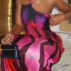 Slim fit halter maxi dress with abstract pink and purple swirls and a side slit
