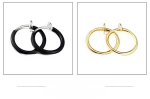 Detail view of spring-loaded hoop earrings in black, silver, and gold finish