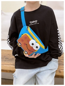 Kid model wearing blue and yellow cartoon bus crossbody bag made of durable nylon fabric