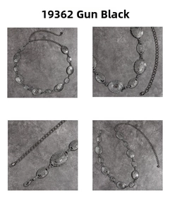 Macro details of vintage gun-black metal waist chain with embossed oval floral patterns