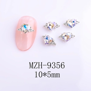 Macro view of Aurora 3D heart nail charms with silver wings, size 10x5mm, model MZH-9356