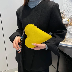 Minimalist heart-shaped yellow leather handbag with a colorful LOVE lettered shoulder strap