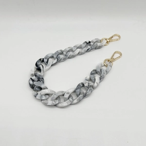 Detail of grey marble acrylic chain link with shiny gold metal lobster clasps