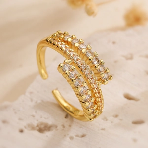 Macro view of gold plated geometric ring with double row zircon stones and open design