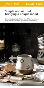 Detailed close-up of ceramic coffee mug with floral engraving and sesame glaze finish