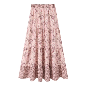Detail of pink bohemian tiered maxi skirt with floral print and elastic high waist