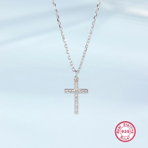 Close-up of S925 sterling silver cross pendant with micro-set zircon on O-chain