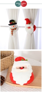 Detail of Christmas snowman and Santa curtain tiebacks made of soft plush fabric