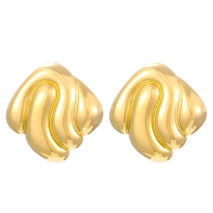Macro detail of vintage 18K gold plated earrings with textured wavy shell design