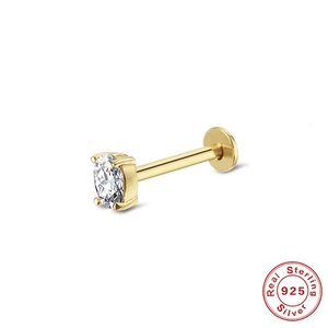 Macro detail of a 925 sterling silver gold stud earring with an oval zircon stone