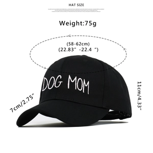 Detail view of Dog Mom embroidery and dimensions on a black cotton baseball cap