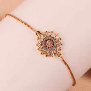 Close-up of gold geometric sun flower bracelet with colorful zircon and box chain