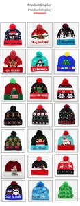 Detail view of 21 knitted Christmas beanies featuring reindeer, Santa and penguins