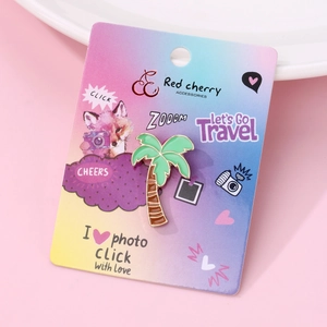 Detail of tropical coconut tree enamel pin on fox illustration card with gold-toned trim