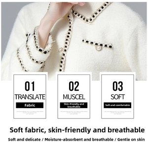 Detailed close-up of white plush jacket with woven trim and elegant pearl buttons