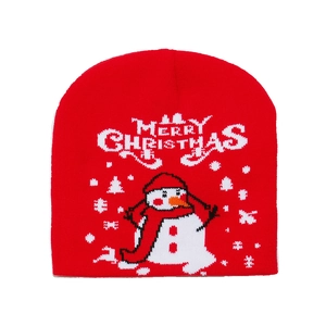 Red knit winter hat with Merry Christmas text and snowman pattern on white background