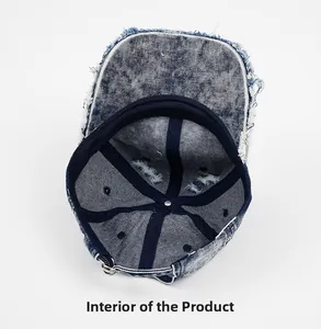 Internal view of a washed denim baseball cap with distressed edges and reinforced seams