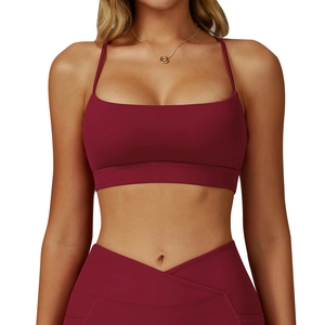 Burgundy sports bra and V-waist yoga leggings set shown on a model against white backdrop