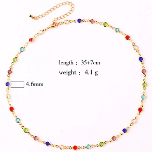 Detail of adjustable gold necklace with colorful round zircons and product measurements