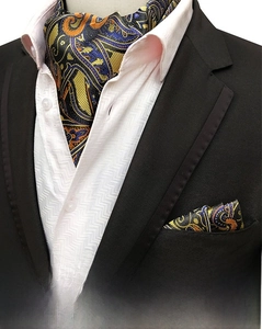 Detailed view of yellow and blue paisley men's cravat and matching pocket square set