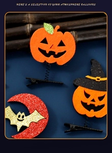 Détail de pinces à cheveux Halloween avec citrouille scintillante et chauve-souris