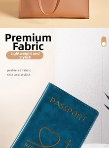 Detailed close-up of dark blue faux leather passport holder with gold heart foil stamp