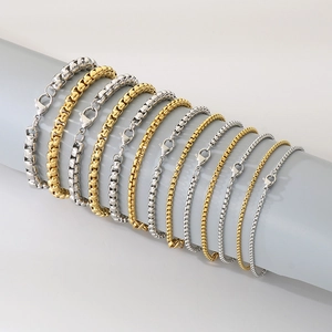 Detail of stainless steel box chain bracelets in gold and silver with lobster clasp