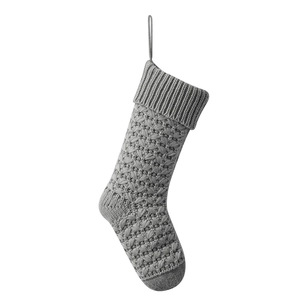 Classic light grey knitted Christmas stocking with thick yarn weave and hanging loop