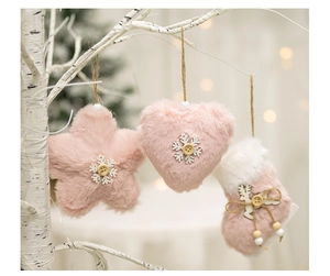 Pink plush Christmas angel charms with star, heart and sock shapes on white branches
