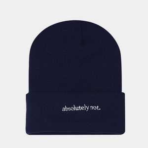Detail view of navy knit beanie featuring white 'absolutely not.' letter embroidery