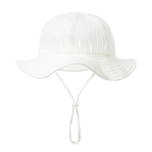 Detail of white cotton baby sun hat with adjustable chin strap and textured fabric