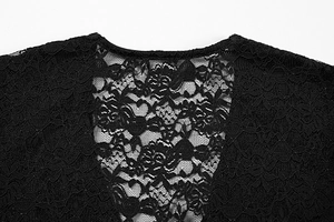 Close-up of floral pattern lace fabric on black deep V-neck top for women