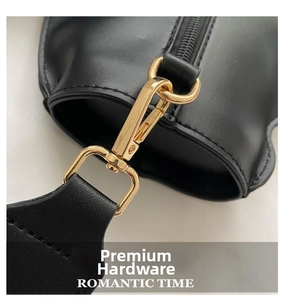 Detail of premium gold-tone lobster clasp and D-ring on black leather cat-shaped bag